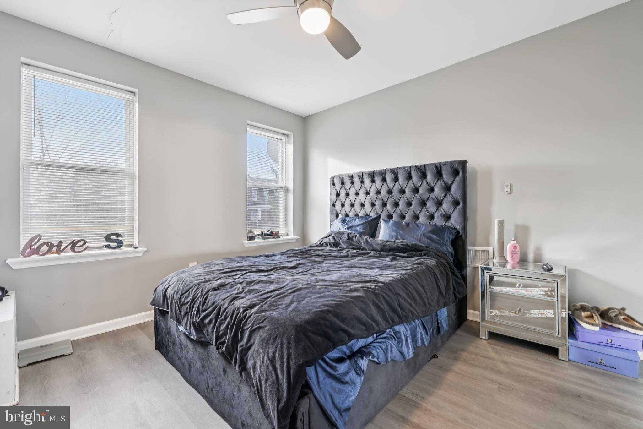 2820 Brighton Street Baltimore, MD 21216 - Photo 18 of 38 a bedroom with a bed and window