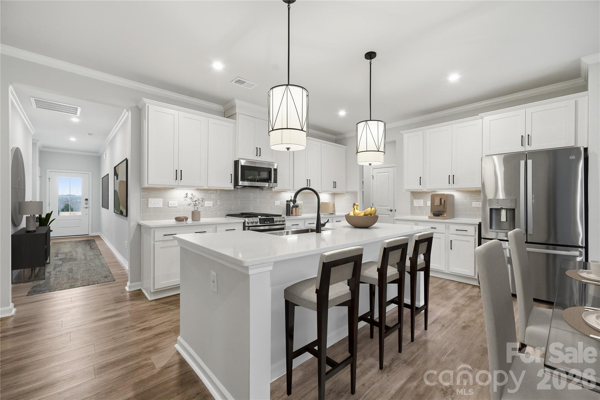 1100 Arundle Road Sherrills Ford, NC 28673 - Photo 11 of 35 a kitchen with stainless steel appliances granite countertop a stove a sink a refrigerator a center island and a cabinets