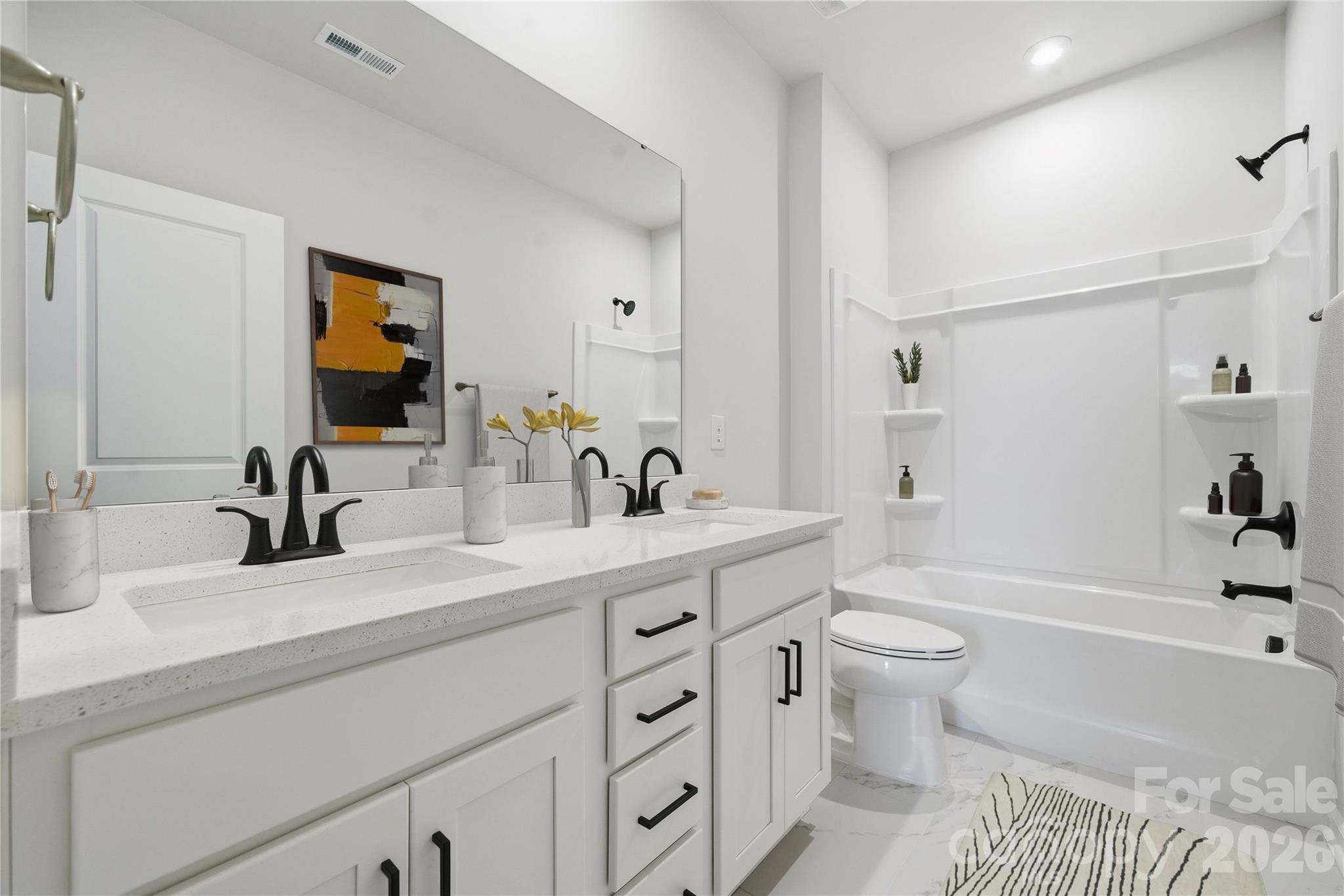 1100 Arundle Road Sherrills Ford, NC 28673 - Photo 19 of 35 a bathroom with a sink a toilet and a large mirror