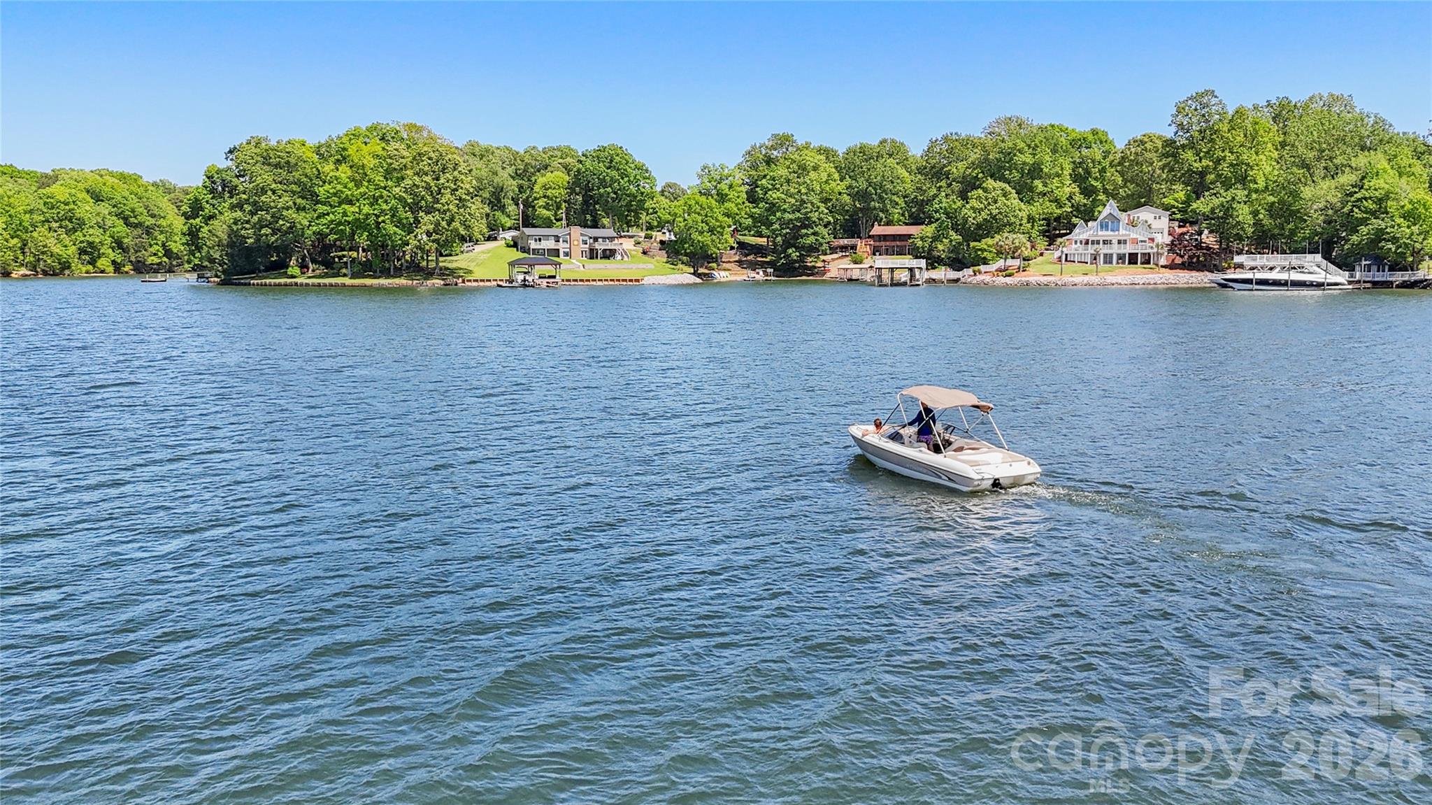 1100 Arundle Road Sherrills Ford, NC 28673 - Photo 6 of 35 a lake view with a bench