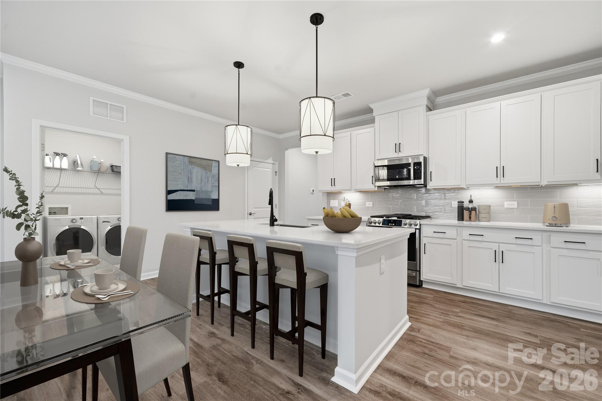 1100 Arundle Road Sherrills Ford, NC 28673 - Photo 10 of 35 a kitchen with stainless steel appliances granite countertop a stove a sink a refrigerator a center island a dining table and chairs