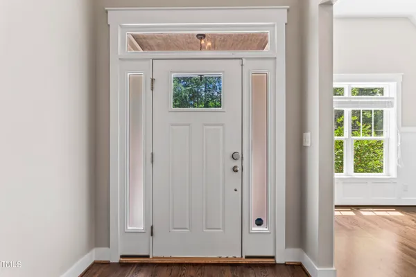 a view of a door with a hallway