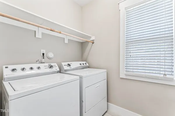 a view of storage and utility room with washer and dryer