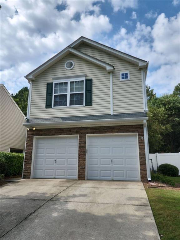 a front view of a house with a garage