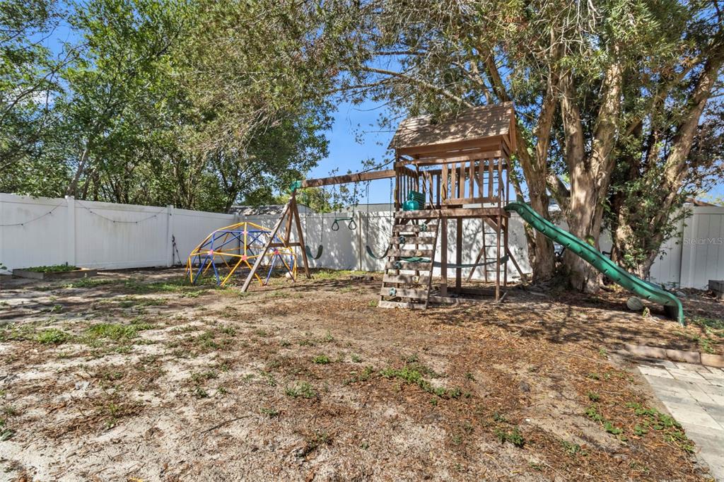 6221 Dalton Street Spring Hill, FL 34606 - Photo 30 of 40 a view of a yard with a house