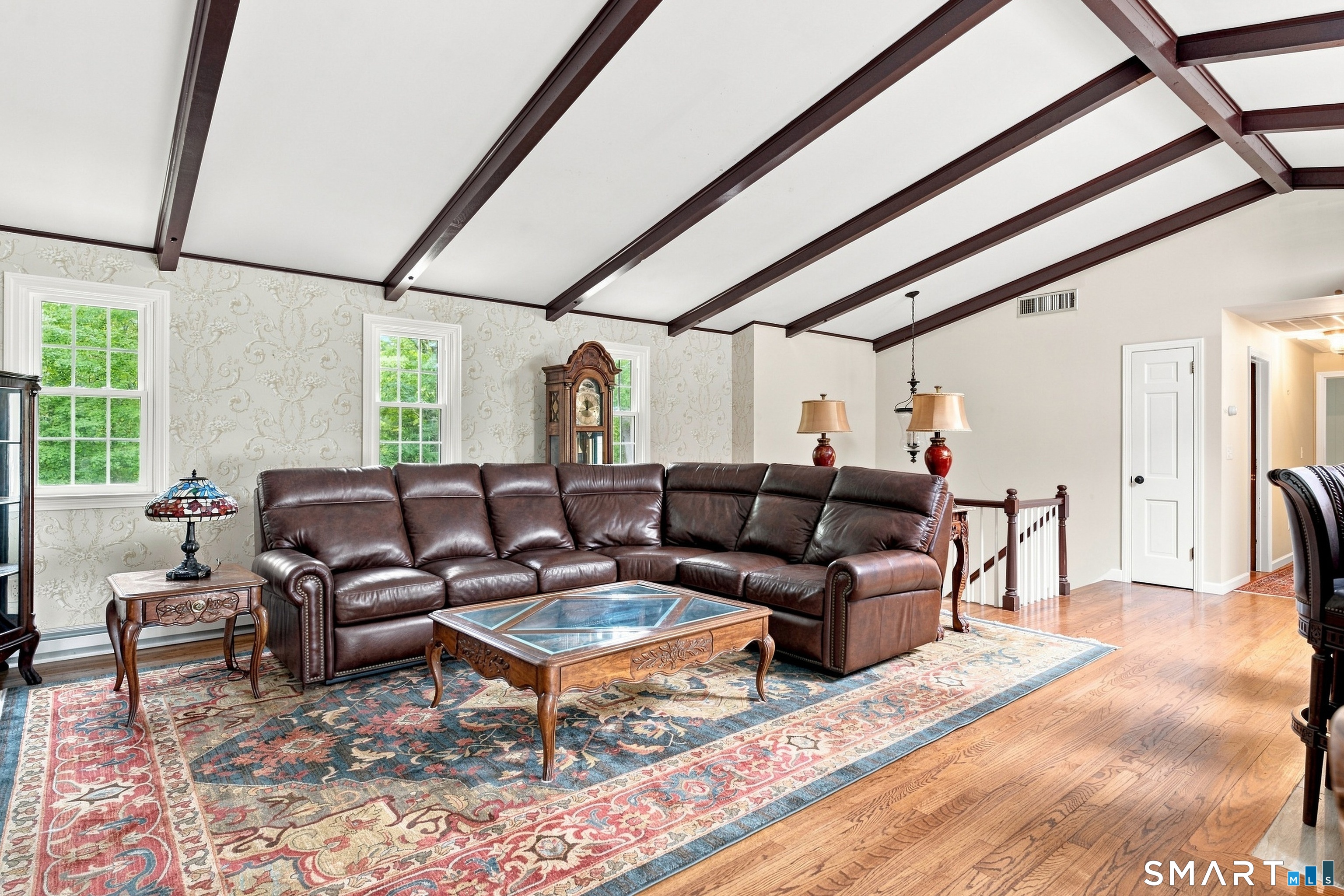 38 Church Lane Madison, CT 06443 - Photo 40 of 40 Main living area with open floor plan, vaulted ceilings and beautiful wooden beams.