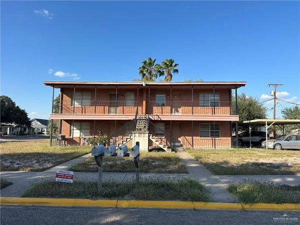 a view of a house with swimming pool and sitting area