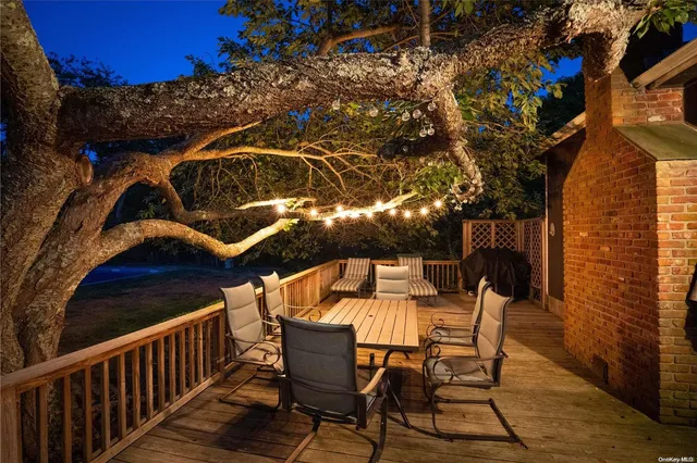 a view of a chairs and table in the balcony