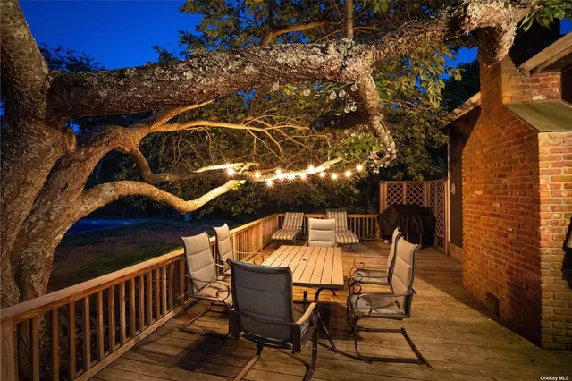 a view of a chairs and table in the balcony