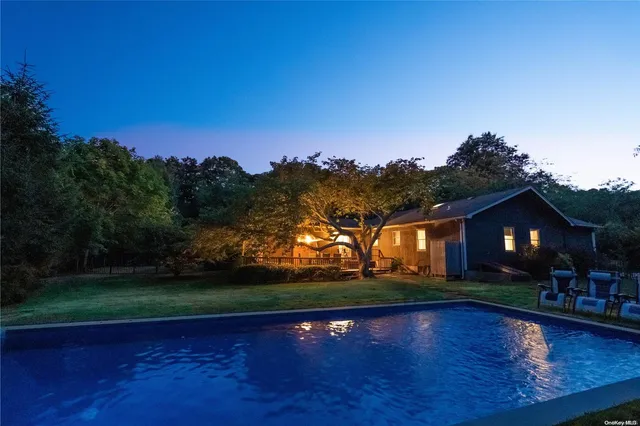 a view of outdoor space with deck and yard