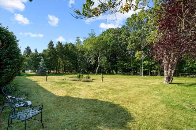 a view of a swimming pool with a yard