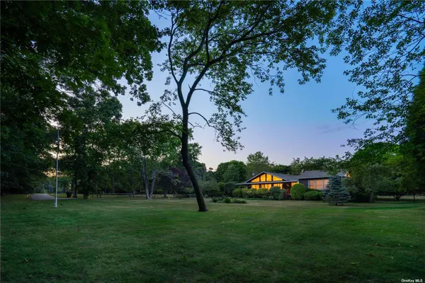 a backyard of a house with lots of green space