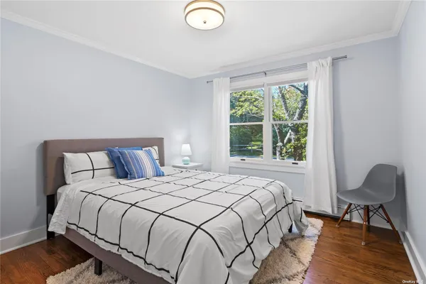 a bedroom with a bed and a chair