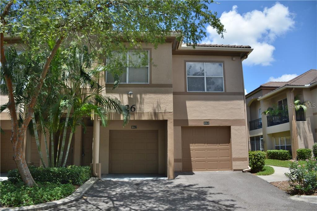 1062 Normandy Trace Road Tampa, FL 33602 - Photo 1 of 1 a view of a house with a small yard and plants