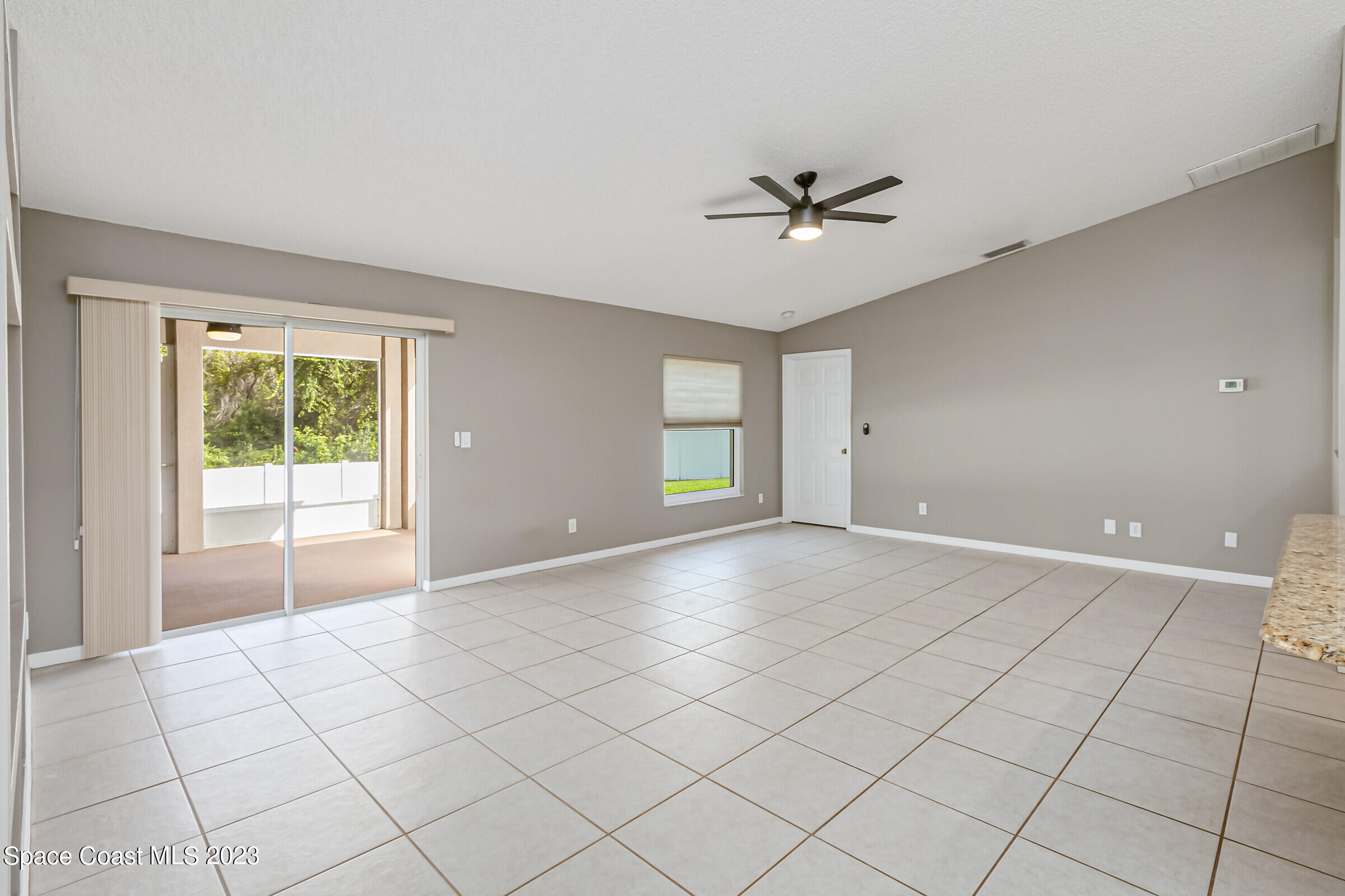 4181 Long Leaf Drive Melbourne, FL 32940 - Photo 11 of 37 a view of an empty room with a window