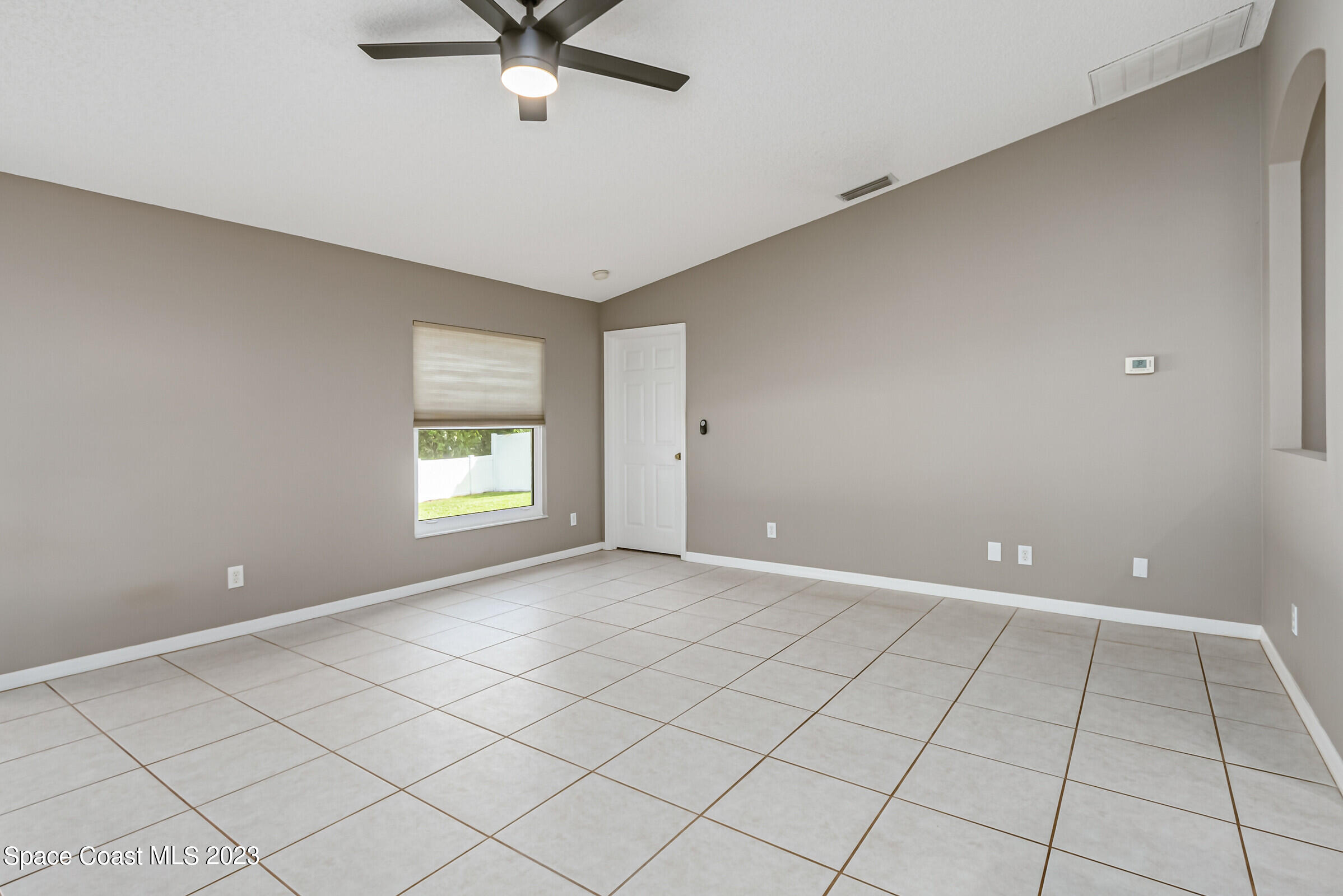 4181 Long Leaf Drive Melbourne, FL 32940 - Photo 12 of 37 a view of an empty room with a window