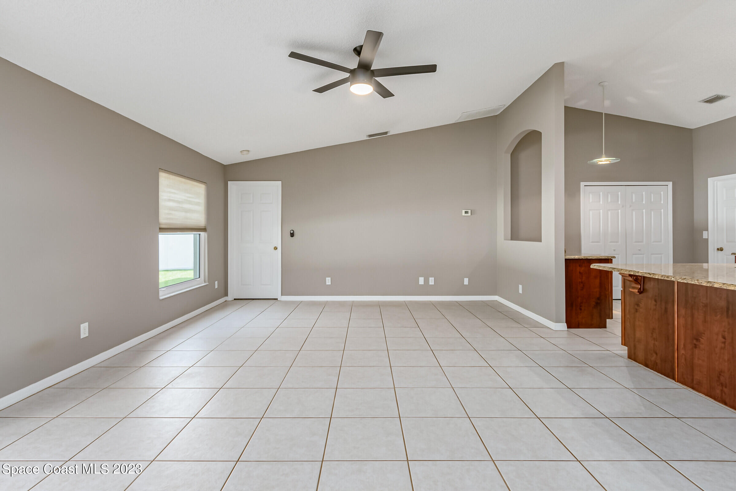 4181 Long Leaf Drive Melbourne, FL 32940 - Photo 13 of 37 a view of an empty room with a window