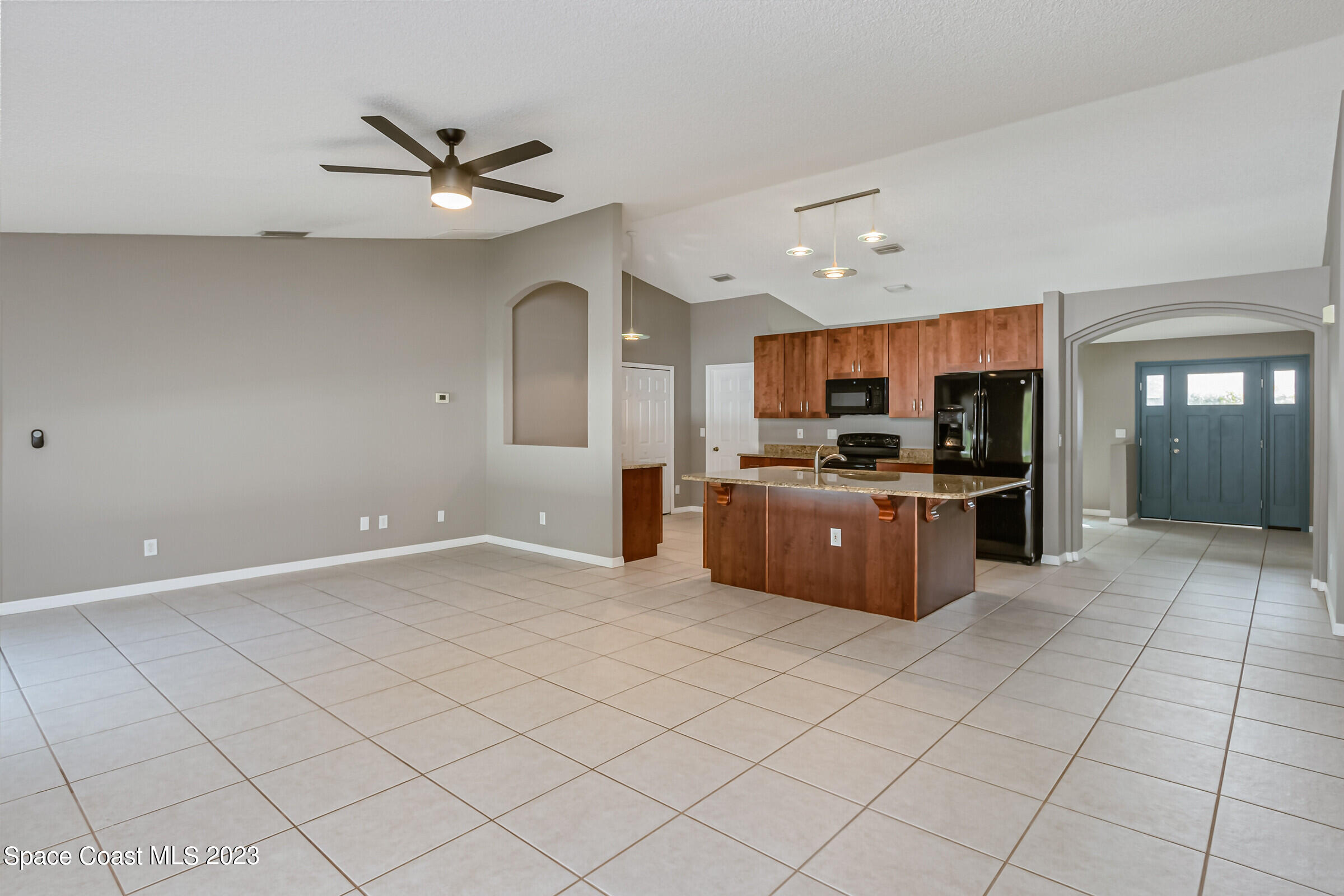 4181 Long Leaf Drive Melbourne, FL 32940 - Photo 14 of 37 a large kitchen with stainless steel appliances a sink and cabinets