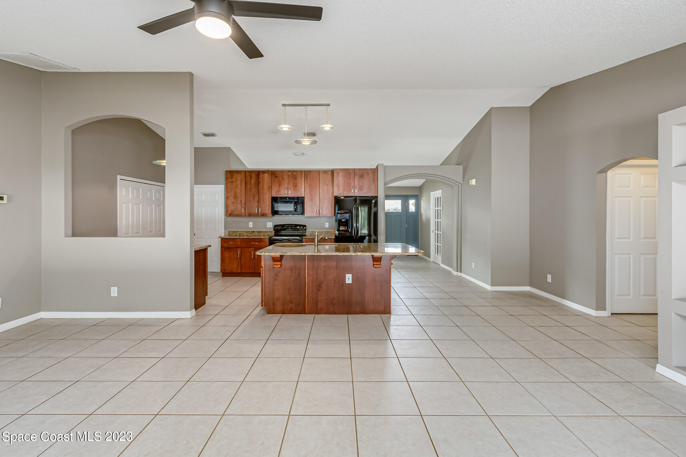 4181 Long Leaf Drive Melbourne, FL 32940 - Photo 15 of 37 a large kitchen with stainless steel appliances lots of counter space and chandelier