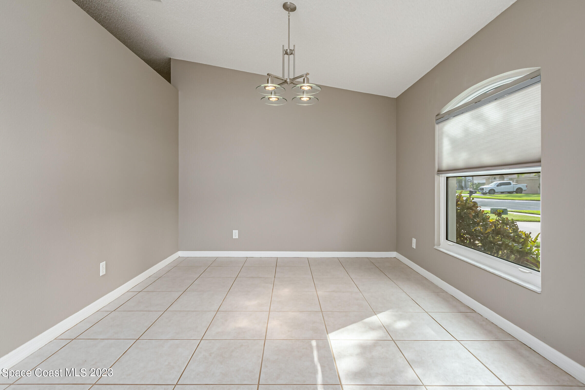 4181 Long Leaf Drive Melbourne, FL 32940 - Photo 17 of 37 a view of an empty room with a window