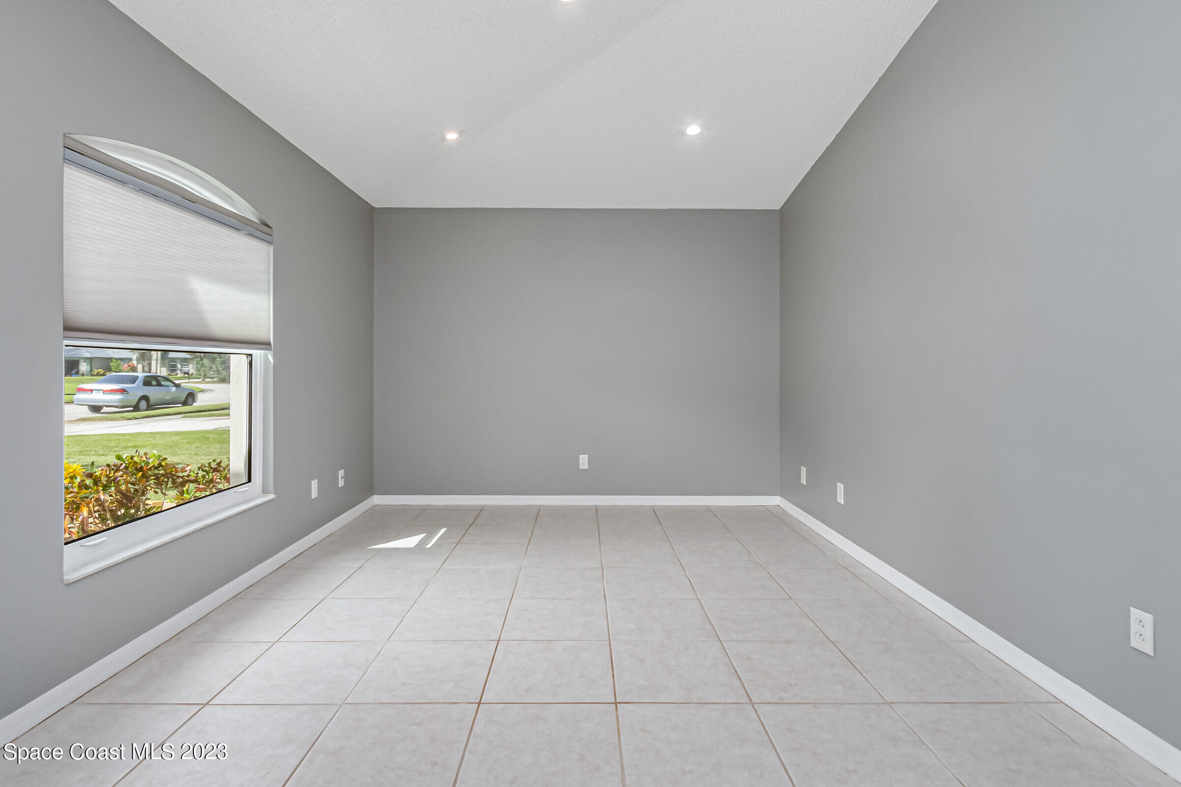 4181 Long Leaf Drive Melbourne, FL 32940 - Photo 18 of 37 a view of an empty room with a window