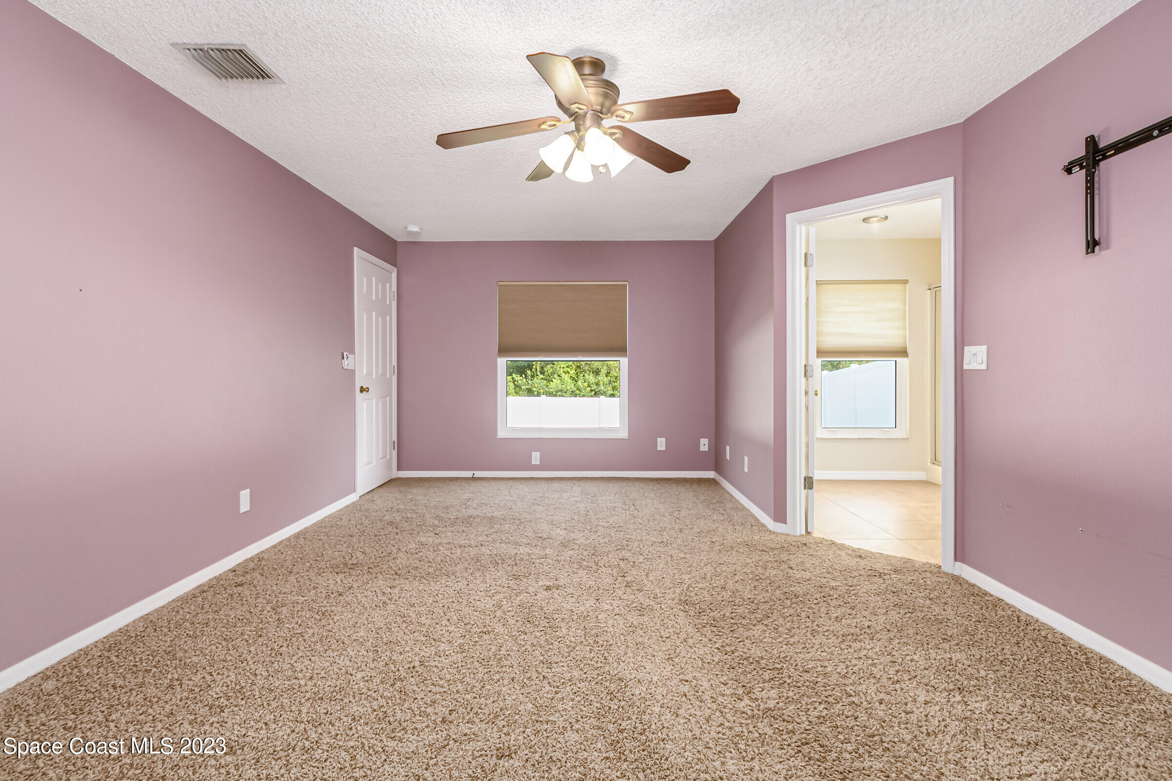 4181 Long Leaf Drive Melbourne, FL 32940 - Photo 22 of 37 a view of an empty room with a window