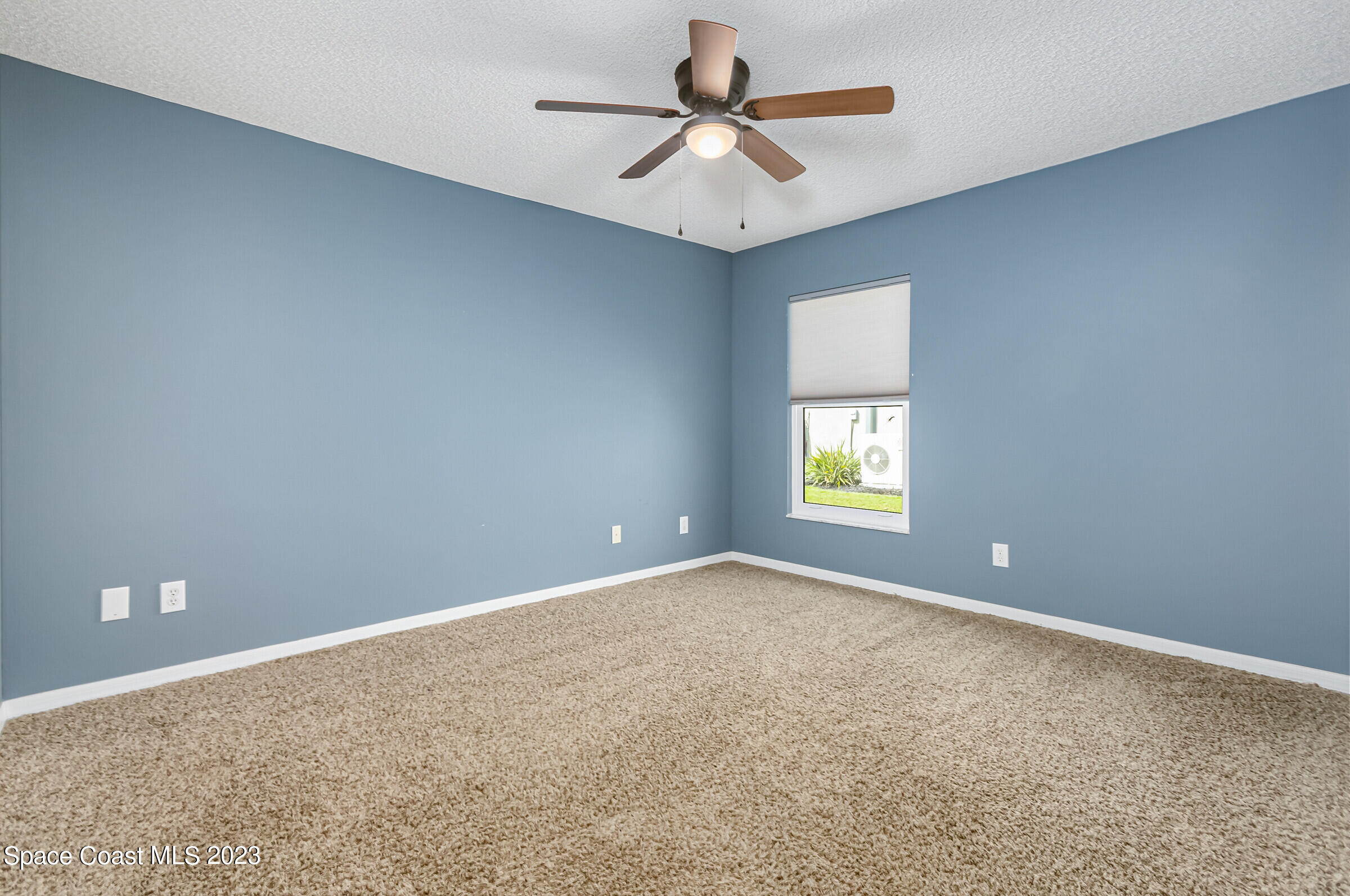 4181 Long Leaf Drive Melbourne, FL 32940 - Photo 25 of 37 a view of an empty room with a window