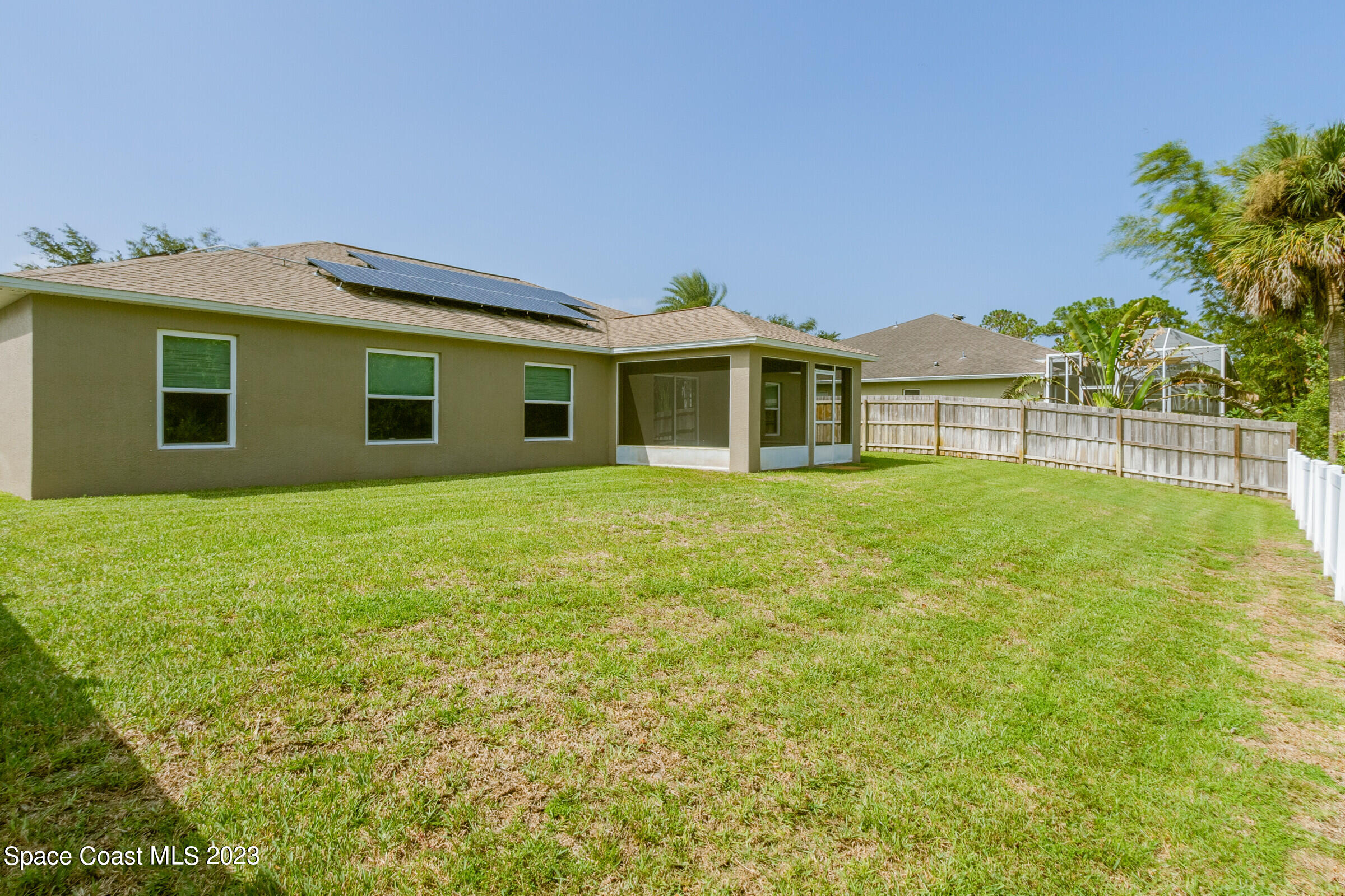 4181 Long Leaf Drive Melbourne, FL 32940 - Photo 31 of 37 a front view of a house with a garden