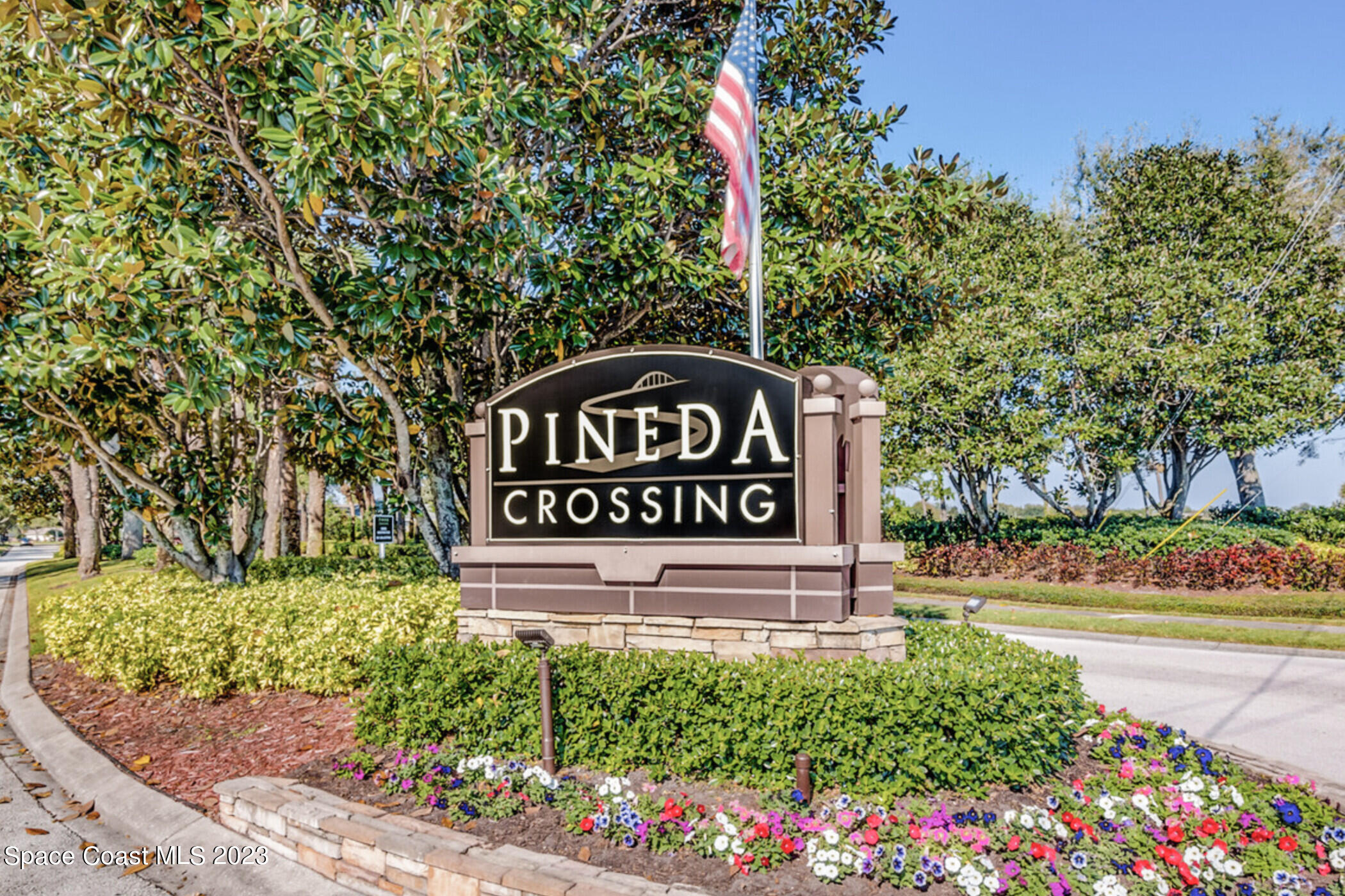 4181 Long Leaf Drive Melbourne, FL 32940 - Photo 35 of 37 a sign that is sitting in front of flowers