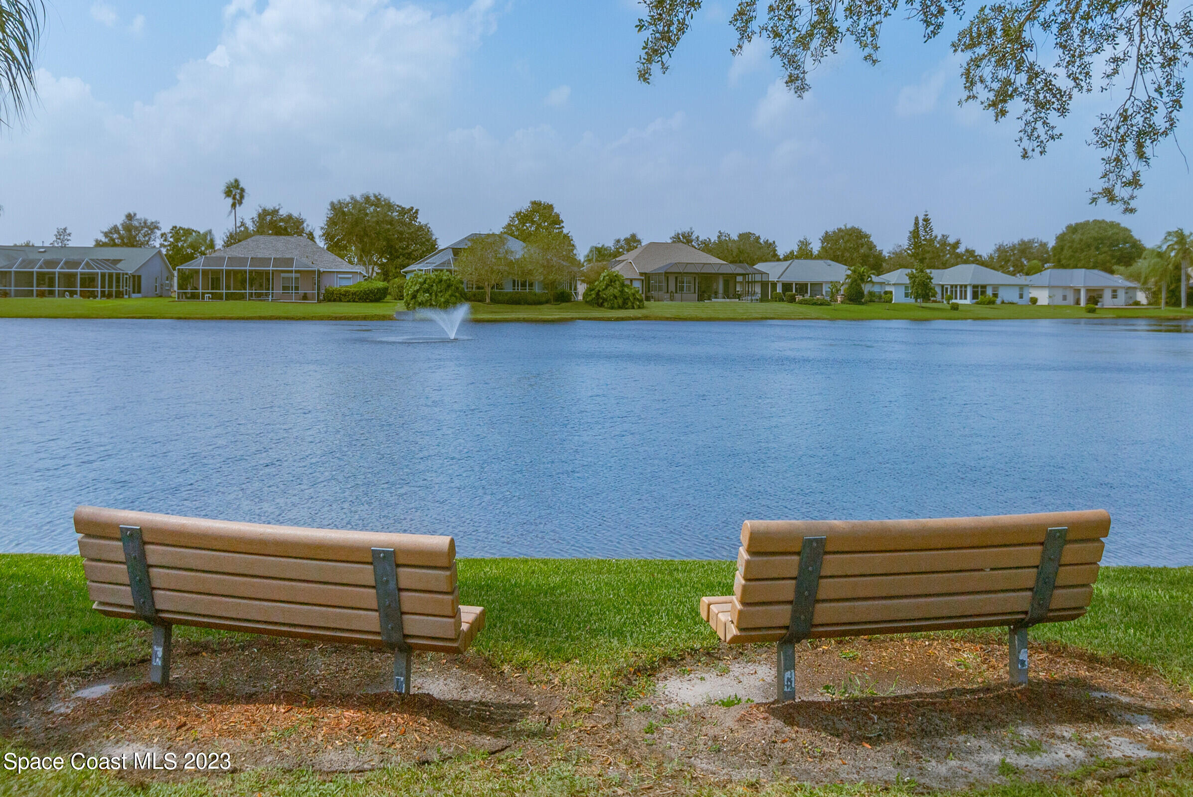 4181 Long Leaf Drive Melbourne, FL 32940 - Photo 36 of 37 a bench that has a bench and a wooden bench