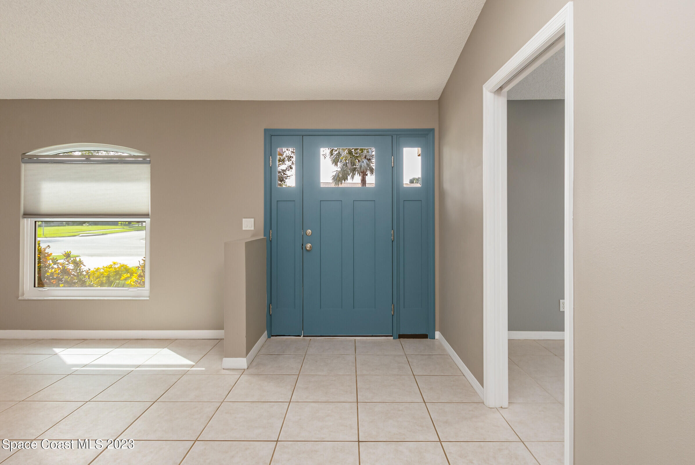 4181 Long Leaf Drive Melbourne, FL 32940 - Photo 4 of 37 a view of an empty room with window and a bathroom