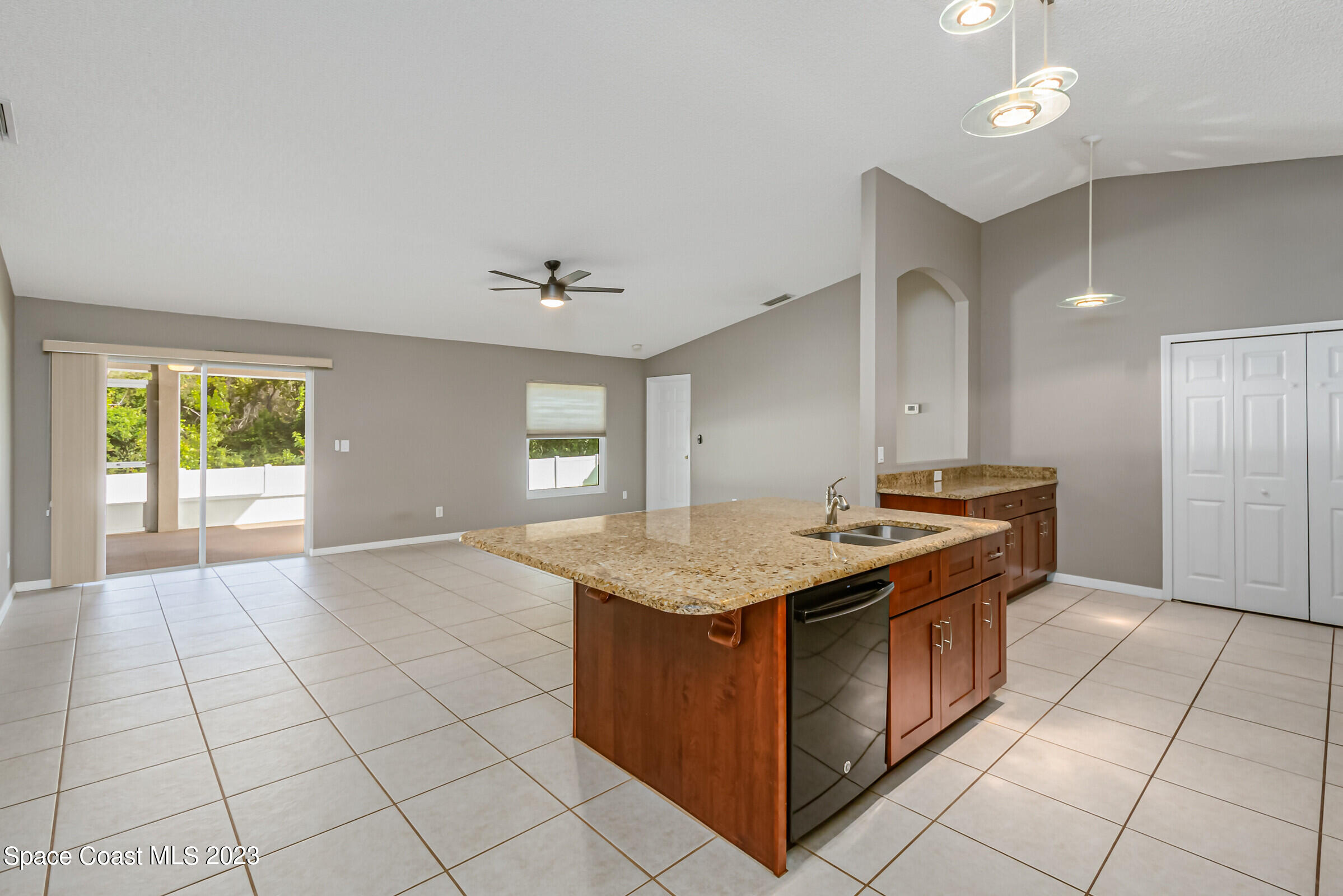 4181 Long Leaf Drive Melbourne, FL 32940 - Photo 6 of 37 a kitchen with stainless steel appliances granite countertop a sink and a stove