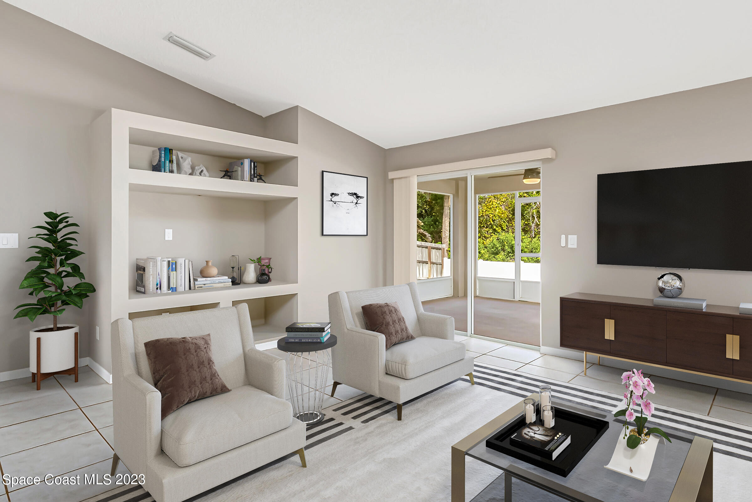 4181 Long Leaf Drive Melbourne, FL 32940 - Photo 8 of 37 a living room with furniture and a flat screen tv