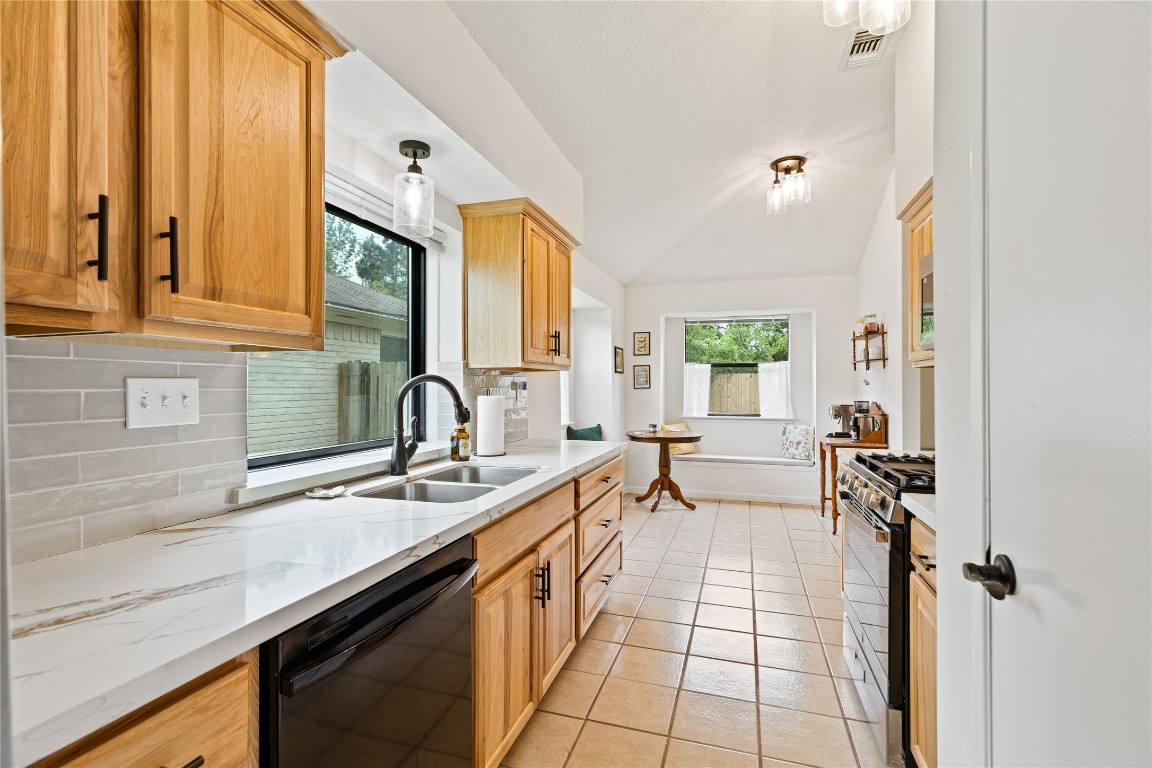 9719 Orangevale Drive Spring, TX 77379 - Photo 12 of 32 Light fills these rooms through the large window over the kitchen sink and in the breakfast room overlooking the back yard making this a bright space for cooking and dining.