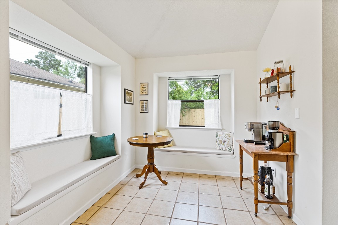 9719 Orangevale Drive Spring, TX 77379 - Photo 14 of 32 Another image of attractive breakfast area surrounded by large windows and convenient banquet seating.