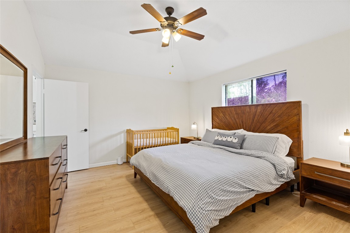 9719 Orangevale Drive Spring, TX 77379 - Photo 15 of 32 Large primary bedroom with attractive wood flooring.