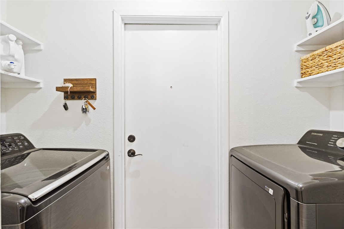 9719 Orangevale Drive Spring, TX 77379 - Photo 25 of 32 Utility room with convenient shelving located between the kitchen and garage.