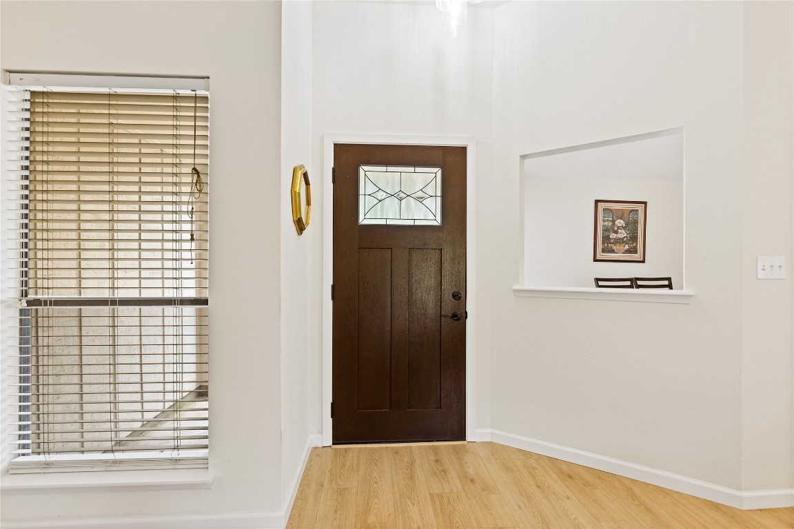 9719 Orangevale Drive Spring, TX 77379 - Photo 4 of 32 Front entrance with large windows and attractive wood flooring.