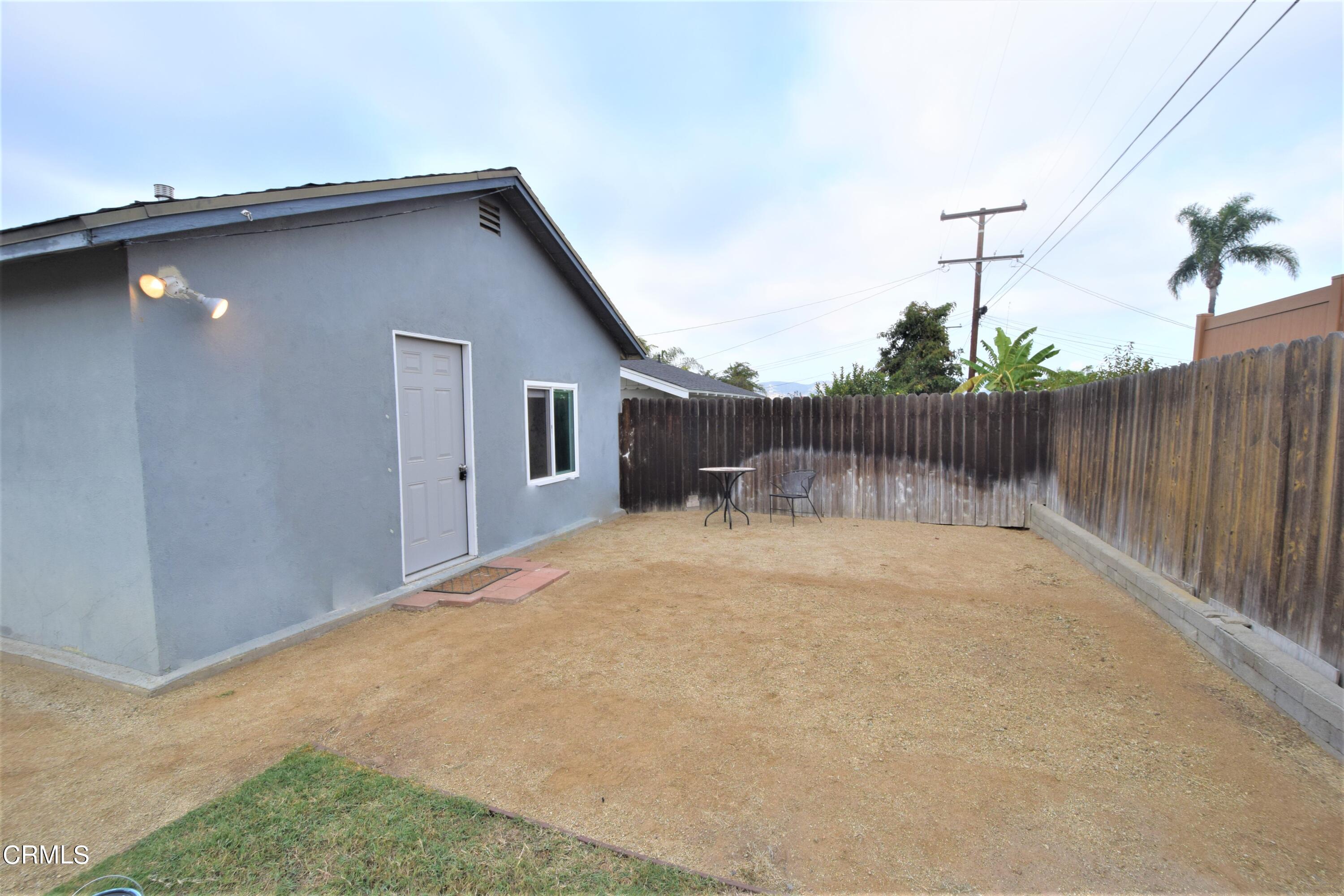 138 Oak Street Camarillo, CA 93010 - Photo 7 of 7 a backyard of a house with table and chairs