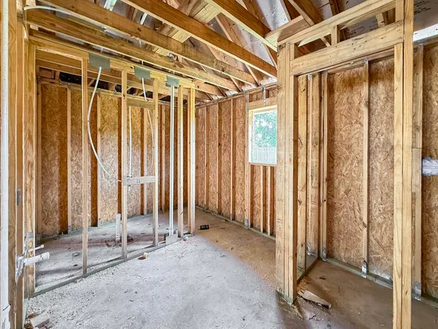 a view of a room with floor to ceiling window and furniture