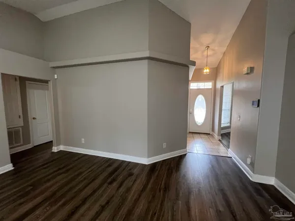 a view of a livingroom with wooden floor