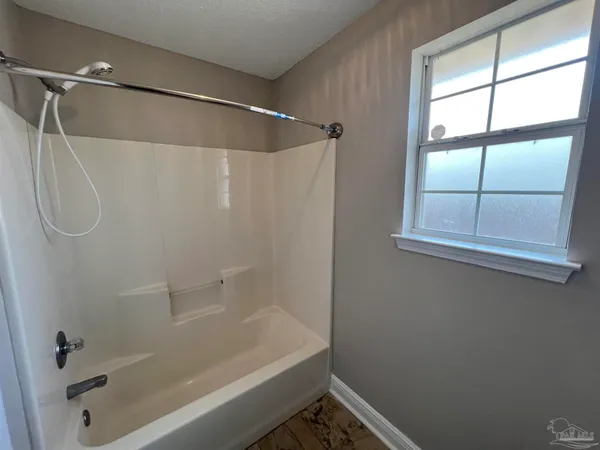 a bathroom with a shower and a shower