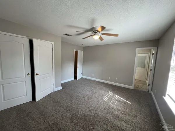 a view of empty room with windows