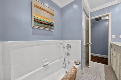 a bathroom with a bathtub and a shower