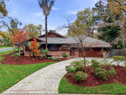 a view of a house with a yard porch and sitting area