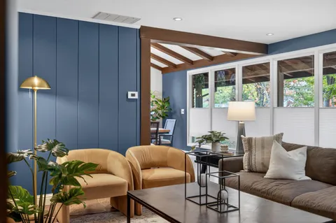 a living room with furniture and window