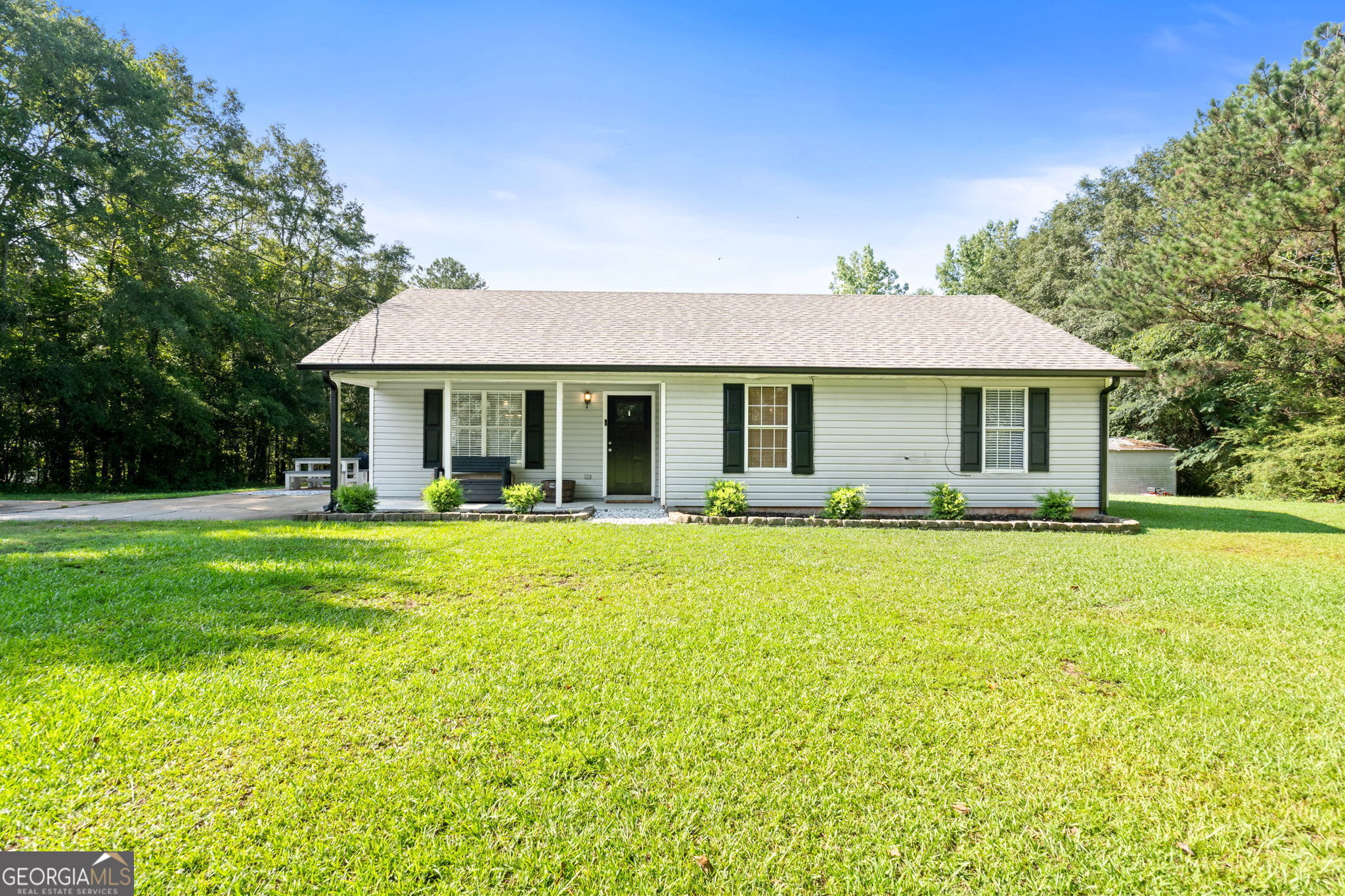 a front view of house with yard and seating area