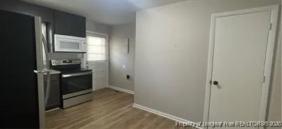 a kitchen with a refrigerator and a sink