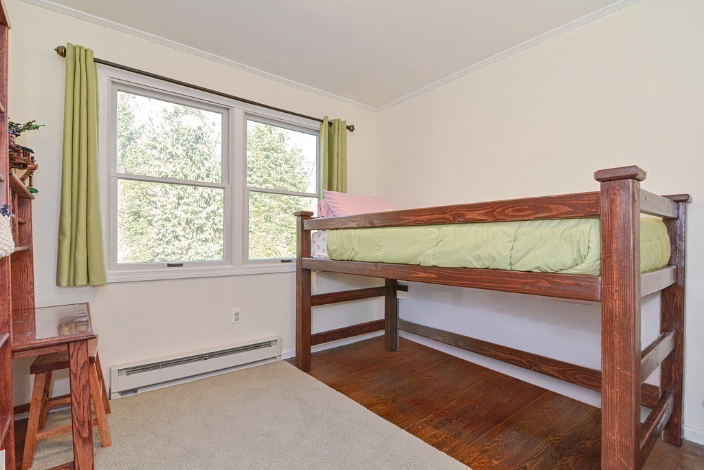 21 Coolidge Street Sherborn, MA 01770 - Photo 16 of 41 a view of an empty room with wooden floor and a window