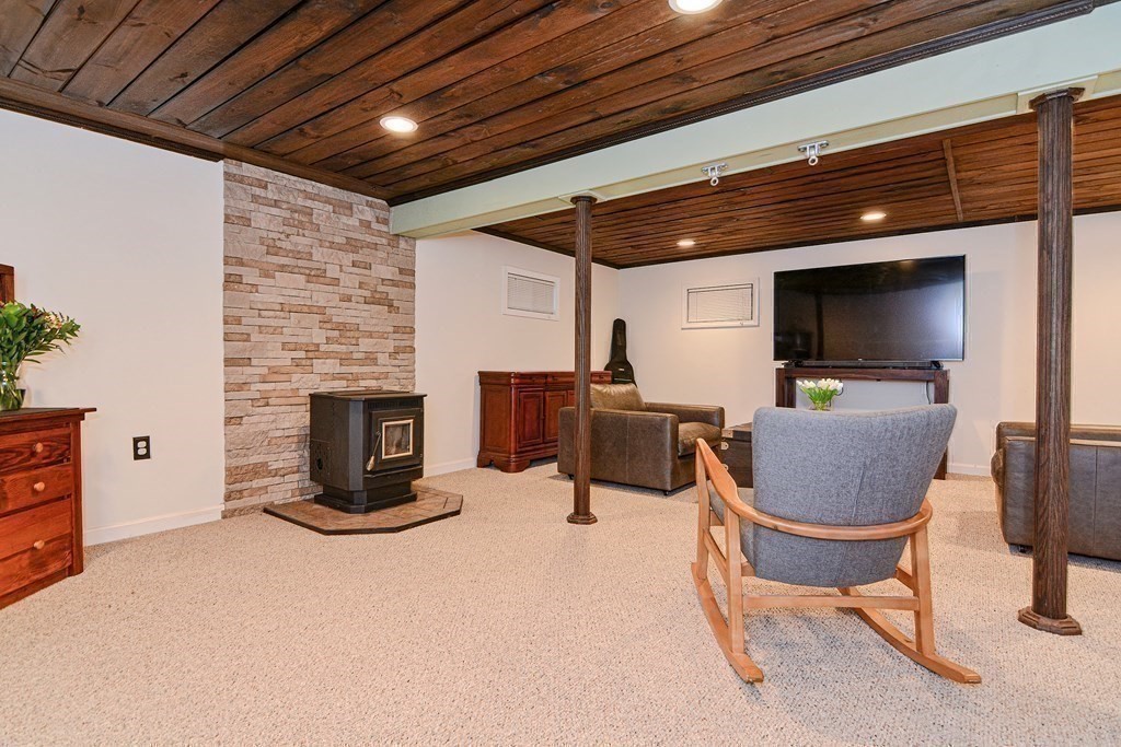 21 Coolidge Street Sherborn, MA 01770 - Photo 20 of 41 a living room with furniture and a flat screen tv